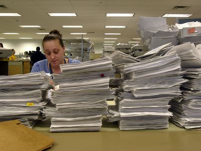 IRS Office with Paperwork Mountain
