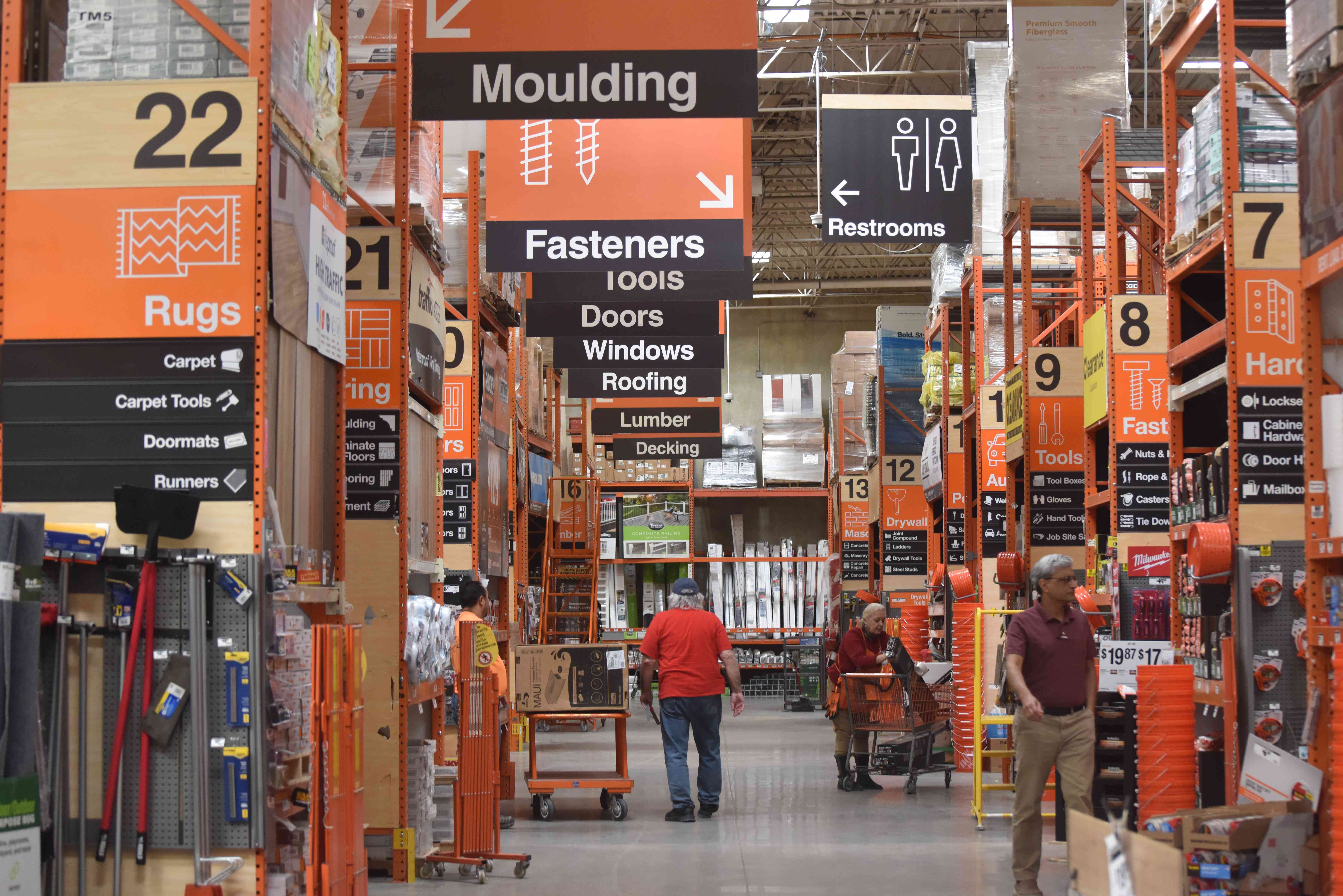 Customers shop at a Home Depot store in Arlington, Virginia, on March 14, 2024.