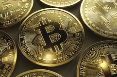 Close up of Shiny New Gold Bitcoins
