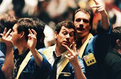 floor brokers gesturing on a trading floor