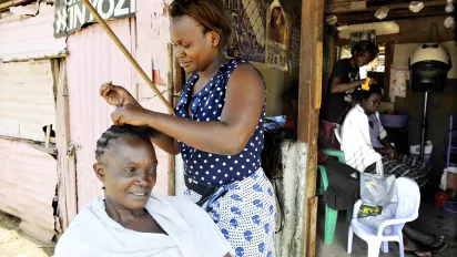 A woman getting a haircut.