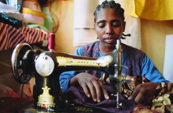 Woman entrepreneur with a  a hearing impairment at work, Addis Ababa, Ethiopia