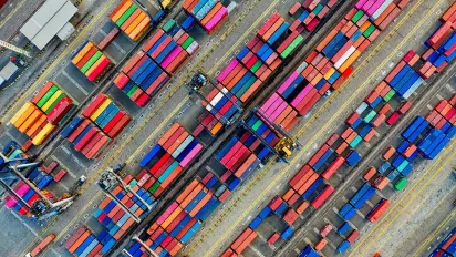 A harbour with containers, photographed from above.