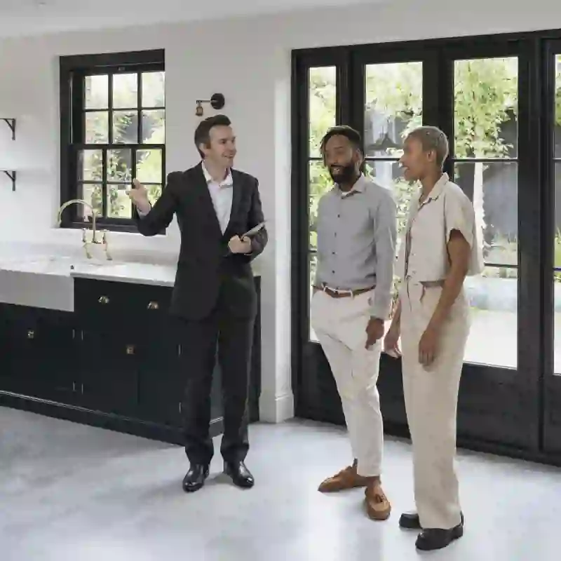 realtor showing clients a house