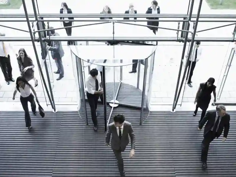 People walking through an office building entrance