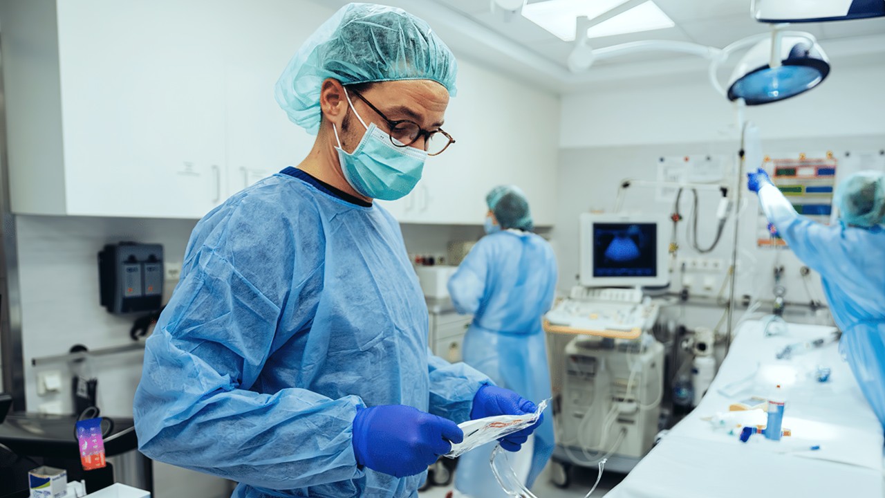 Surgeon prepares operating room