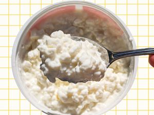 Cottage cheese in a spoon.