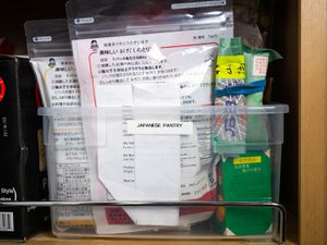 Plastic box filled with containers of non-perishable Japanese pantry ingredients
