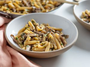 two servings of pasta ai funghi in Jono Pandolfi ceramic bowls