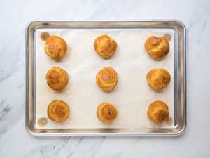 baked choux pastry puffs on a sheet