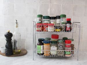 spices in a metal spice rack on a counter