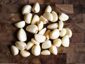 Overhead photo of peeled garlic.