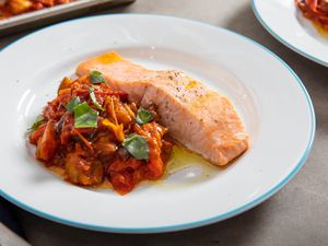 Salmon alongside a tomato eggplant stew, all made on a sheet-pan