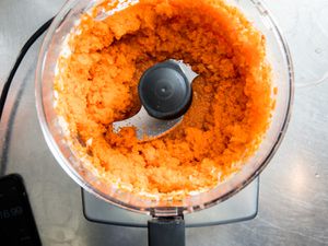 Minced carrots in a food processor bowl