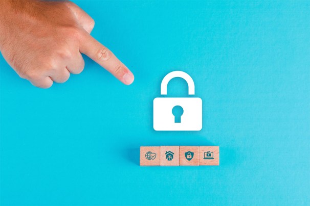 A person pointing to an icon of a white lock on a blue background.