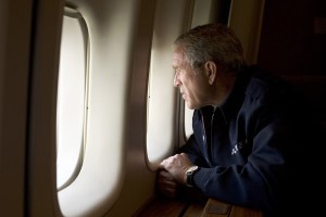 UNSPECIFIED - AUGUST 31:  In this handout photo provided by the White House, U.S. President George W. Bush looks out over devastation from Hurricane Katrina as he heads back to Washington D.C. August 31, 2005 aboard Air Force One. Bush cut short his vacation and returned to Washington to monitor relief efforts for Hurricane Katrina.  (Photo by Paul Morse/White House via Getty Images)