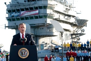 US President George W. Bush addresses the nation aboard the nuclear aircraft carrier USS Abraham Lincoln 01 May, 2003, as it sails for Naval Air Station North Island, San Diego, California. Bush declared major fighting over in Iraq, calling it "one victory in a war on terror" which he said would continue until terrorists are defeated. "In the Battle of Iraq, the United States and our allies have prevailed," Bush said. Bush touted Saddam Hussein's ouster as "a crucial advance" towards stamping out extremist violence.AFP Photo/Stephen JAFFE (Photo by STEPHEN JAFFE / AFP) (Photo by STEPHEN JAFFE/AFP via Getty Images)