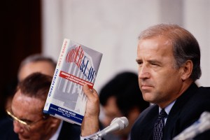 Senator Joseph Biden holds up the book Order and Law by Charles Fried during the Clarence Thomas hearings. (Photo by © Wally McNamee/CORBIS/Corbis via Getty Images)