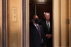 WASHINGTON, DC - MAY 20: Senate Minority Leader Mitch McConnell (R-KY) (R) boards an elevator as he leaves a Senate Republican caucus luncheon meeting in the Russell Senate Office Building on Capitol Hill on May 20, 2021 in Washington, DC. Republicans in the Senate appear to be poised to vote against the formation of a independent commission to investigate the January 6 assault of the U.S. Capitol by Trump supporters. (Photo by Chip Somodevilla/Getty Images)