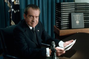 President Nixon announces that he will release certain tapes and transcripts of his conversations in the Oval Office. Transcripts are displayed behind him. (Photo by © Wally McNamee/CORBIS/Corbis via Getty Images)