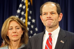 NEW YORK - MARCH 10:  New York Governor Eliot Spitzer speaks to the media with his wife Silda Wall Spitzer while delivering an apology to his family and the public following reported links to a prostitution ring March 10, 2008 in New York City. Spitzer apologized to his family and public during the press conference but did not directly address the reports of his being linked to a prostitution ring.  (Photo by Mario Tama/Getty Images)