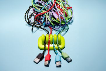 mess of usb cords in an organizer