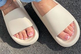 woman with french pedicure and sandels