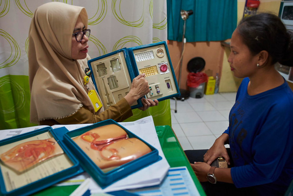 A female counselor speaks to a woman about contraceptive methods, Indonesia