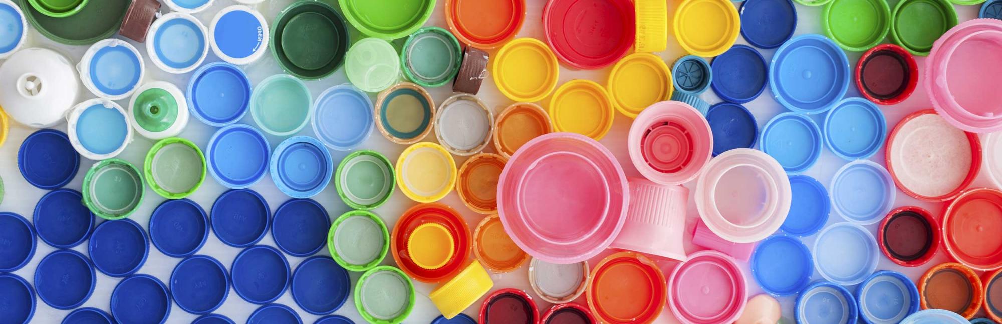 Lots of brightly coloured plastic bottle lids