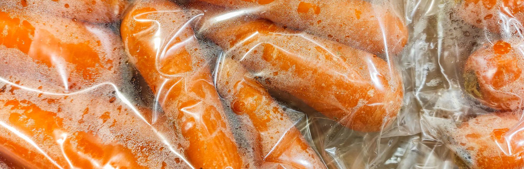Carrots wrapped in flexible plastic packaging 