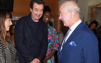 King Charles III, Patron of the Royal Academy of Dramatic Art (RADA), speaking to former students, including Daniel Mays, during a visit to RADA
