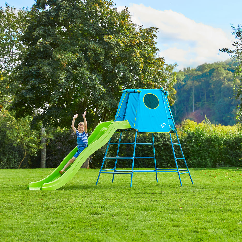 Child sliding down plastic garden slide
