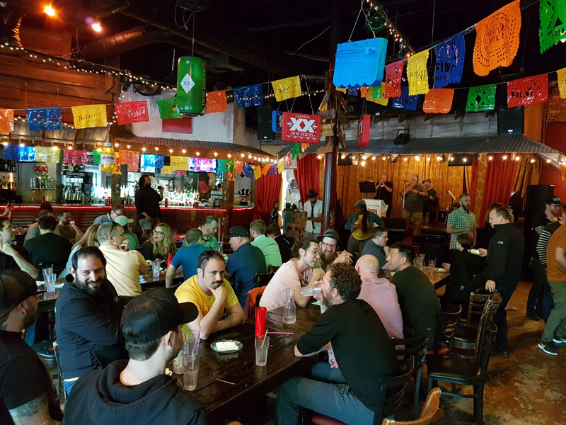A wide shot of Intellum employees enjoying a meal together at a Mexican food restaurant 