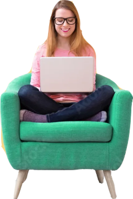a woman sitting on a couch with a laptop.