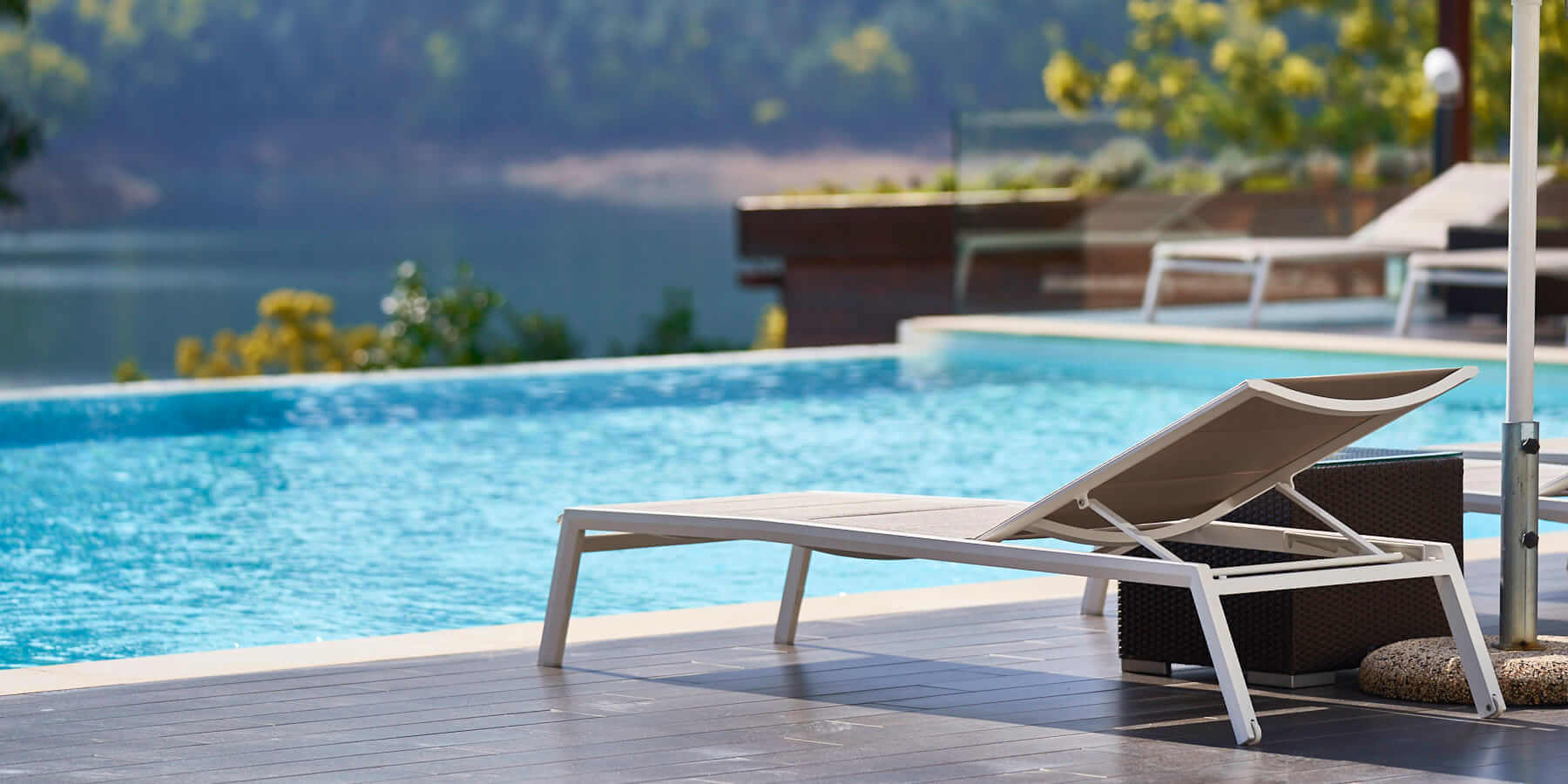 Sun lounger by the pool at juicy oasis