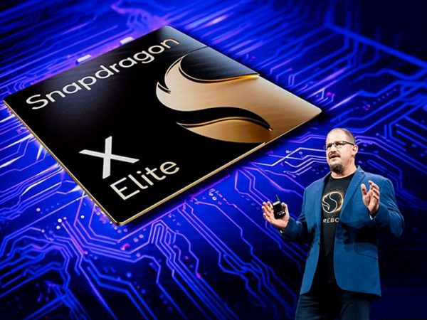 Man standing in front of Snapdragon X Elite chip image making a presentation
