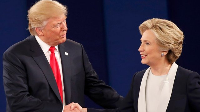 Republican U.S. presidential nominee Donald Trump and Democratic U.S. presidential nominee Hillary Clinton shake hands at the conclusion of their presidential town hall debate at Washington University in St. Louis, Missouri, U.S.