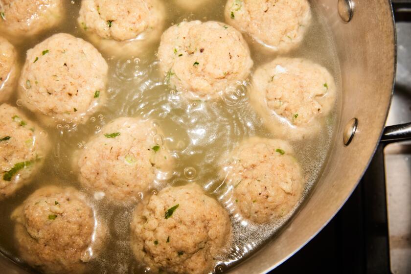 LOS ANGELES, CA - APRIL 1: Chef Michael Twitty prepares matzoh balls to accompany his okra gumbo, featured in his cookbook KosherSoul, in the Los Angeles Times Test Kitchen on Monday, April 1, 2024.