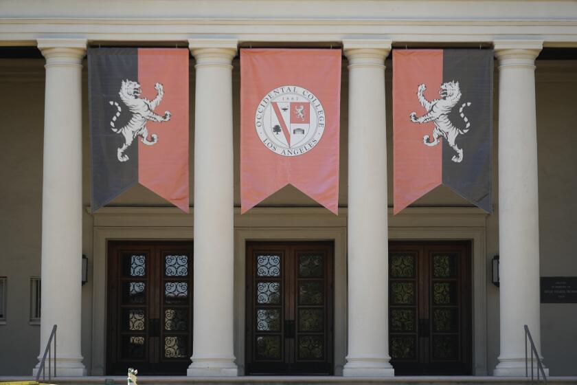 The Occidental College logo is displayed at the Thorne Hall in Los Angeles, Thursday, July 27, 2023. Occidental College is the latest school to end legacy admissions in the wake of a Supreme Court decision removing race from admissions decisions. (AP Photo/Damian Dovarganes)