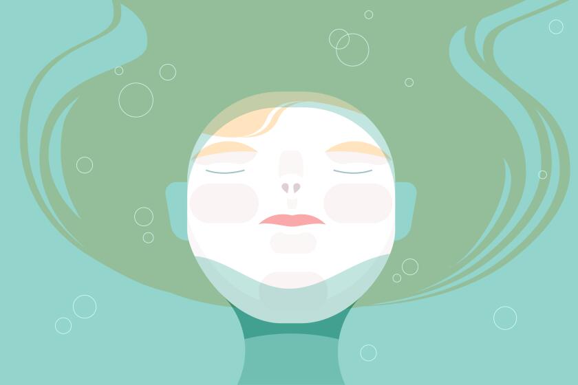 Overhead view of a woman's face above the water.