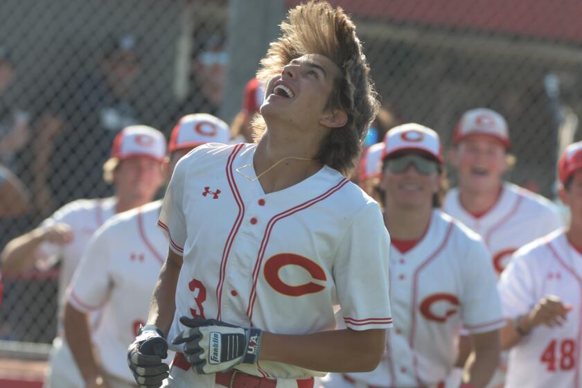 Billy Carlson celebrates with a smile after his walk-off home run lifts Corona to a 1-0 win over El Dorado.