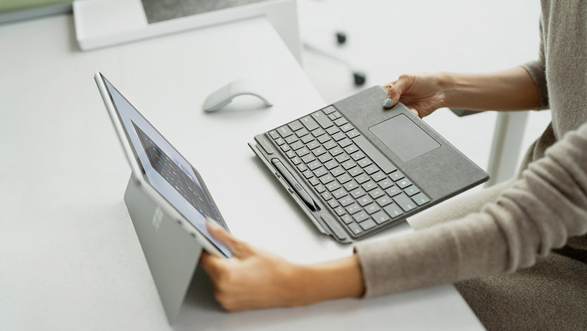 Surface Pro 9 for Business being used with a Surface keyboard and Surface Arc Mouse.