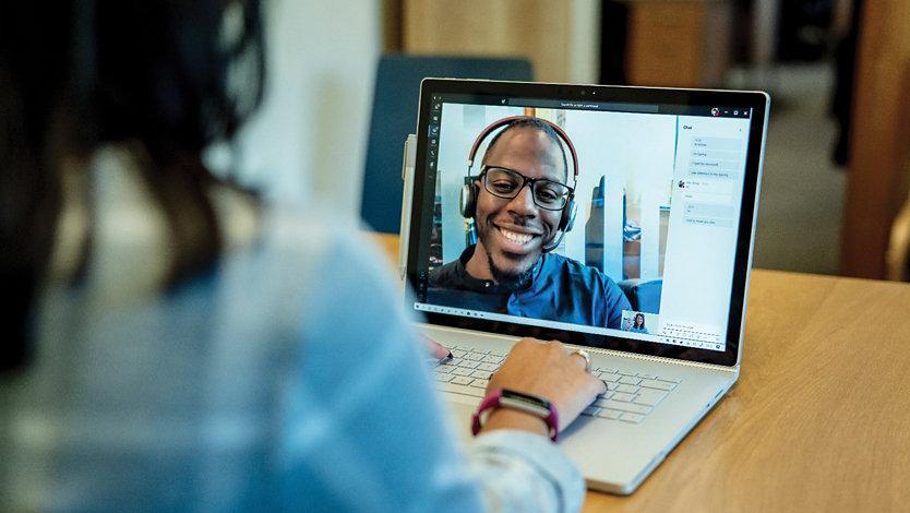 A person chats with a Microsoft Store associate on a video call.