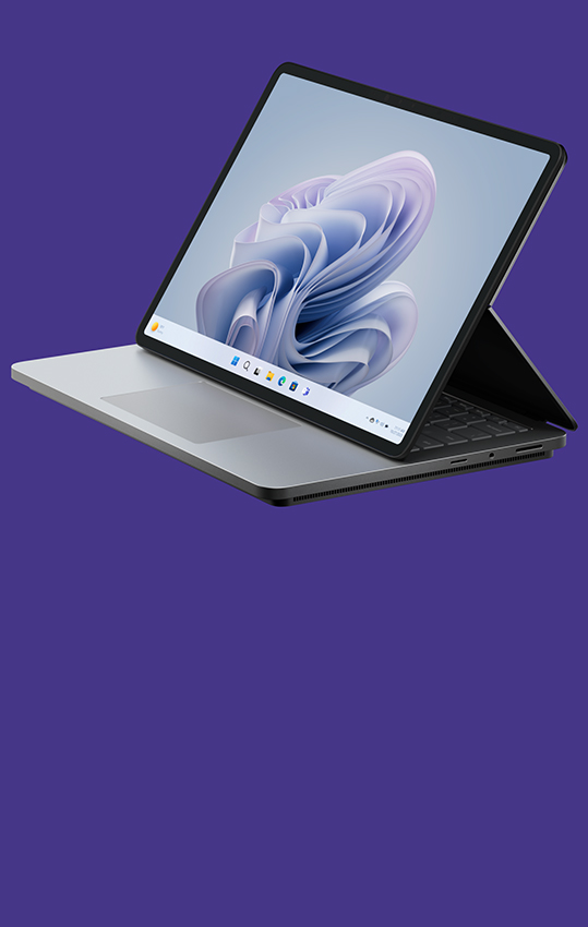 Boční záběr na zařízení Surface Laptop Studio 2 zobrazující květ Windows na obrazovce.