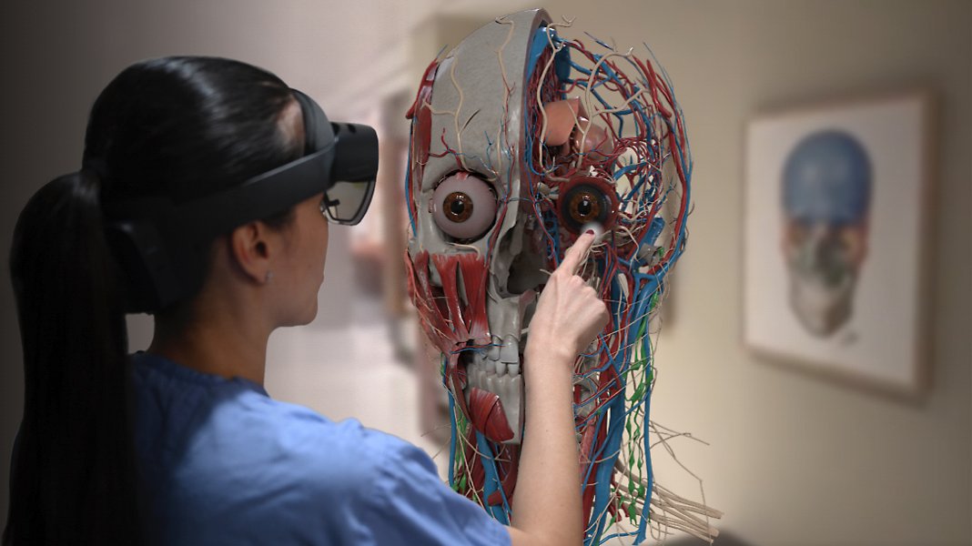 A person looking inside of a human head in augmented reality with HoloLens 2.