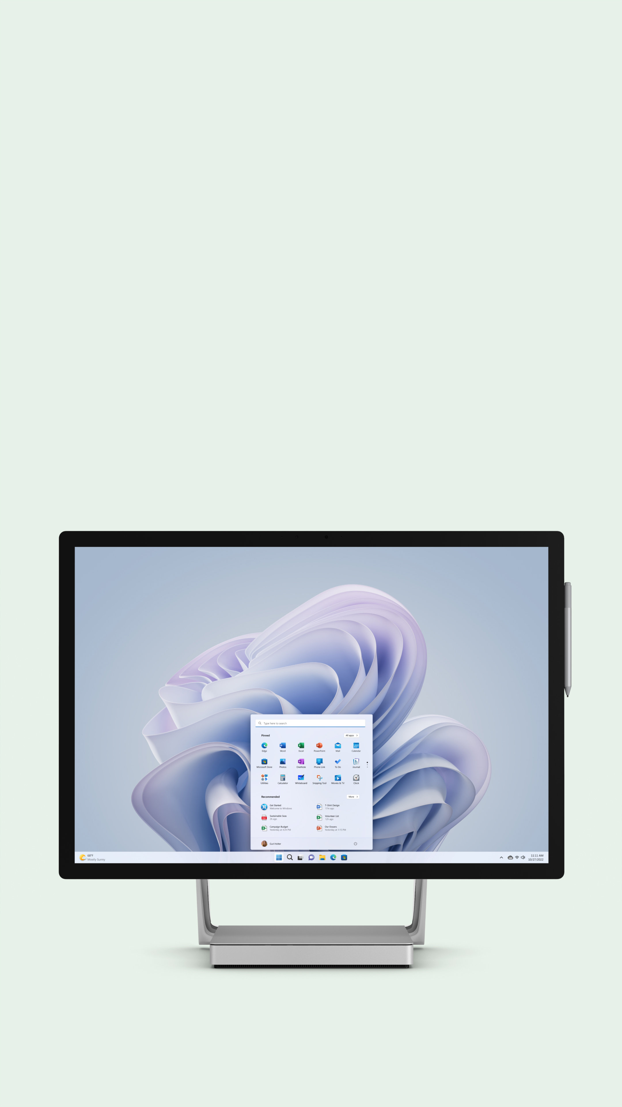 Surface Studio 2+ in desktop mode on a sage background.