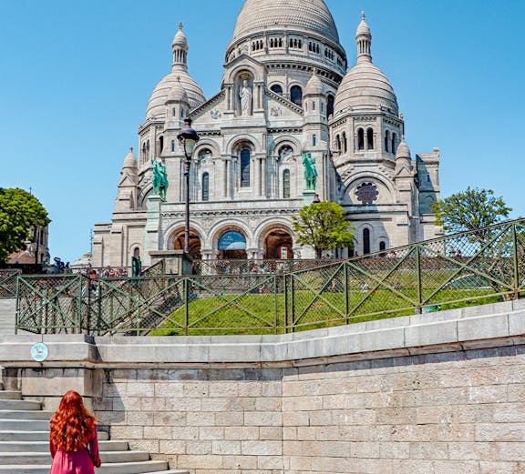 Women infront of Sacre-Coeur basilica in Paris.