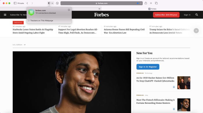 The Forbes homepage along with 1Blocker's ads blocked count.