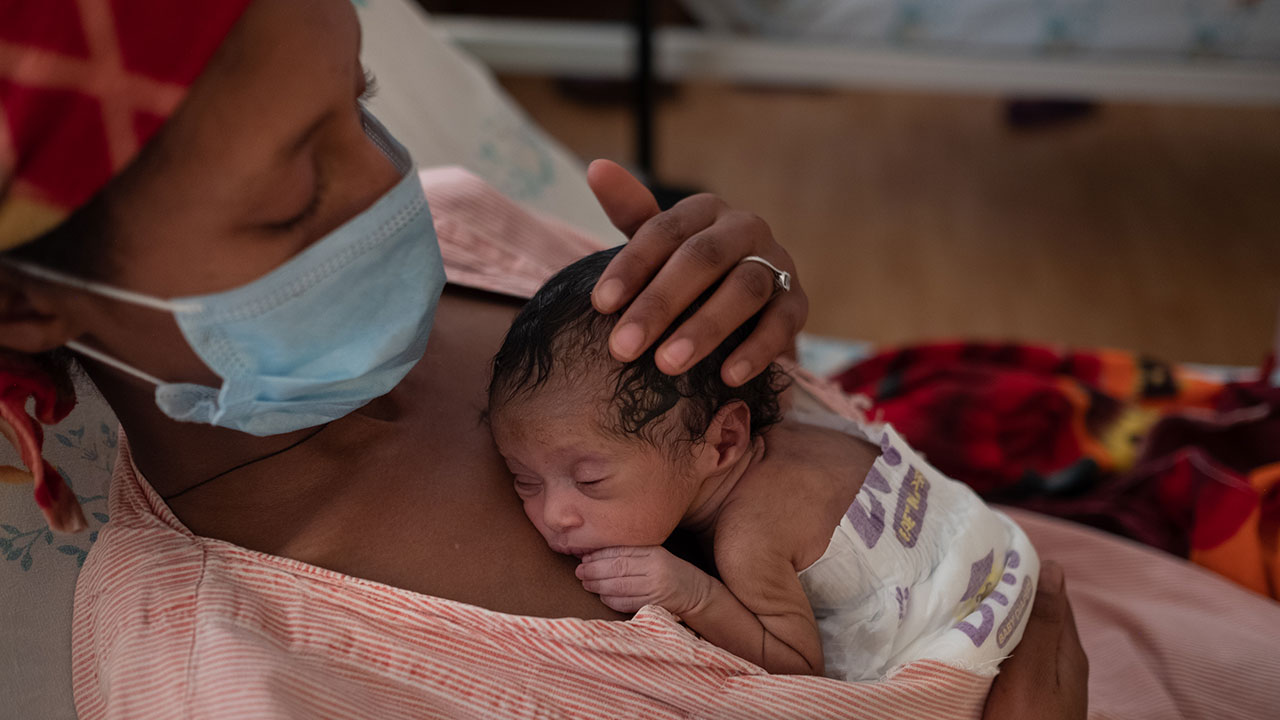 Yeshihareg Nega provides skin-to-skin care to her  preterm baby at the KMC unit at Felege Hiwot Hospital in Bahir Dar Ethiopia on 25 March 2021.