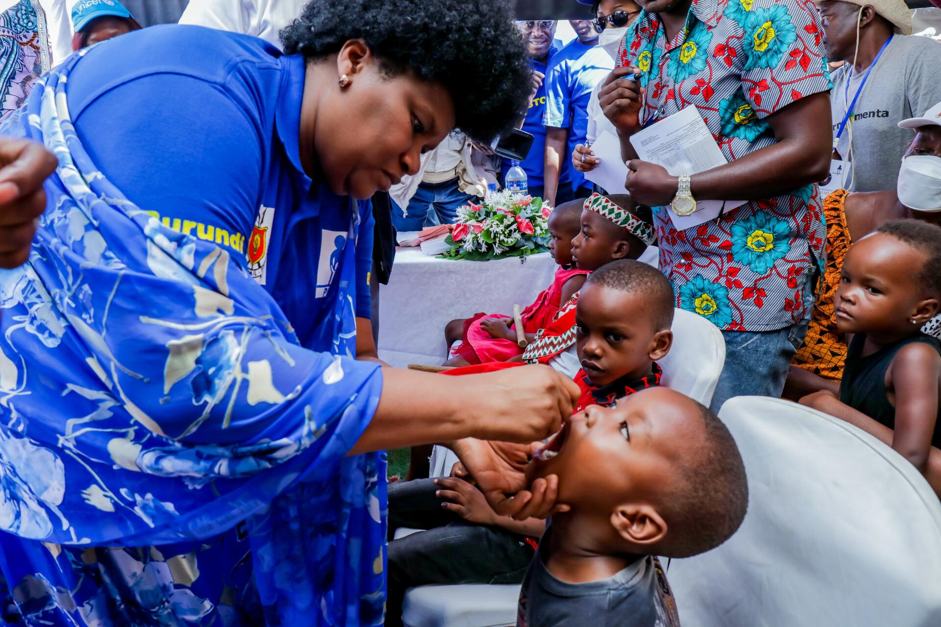 Burundi Health Minister Dr Sylvie Nzeyimana gives an oral polio vaccine to a child